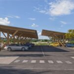 French startup BoucL Énergie is constructing wooden solar canopies in Gard, aiming to power over 250 homes and businesses. The project promotes collective energy use, combining sustainability with clean energy access, and is set to launch by late 2025 with EV charging and low-carbon design.