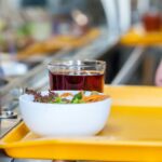 French university canteens began offering one-euro three-course meals — starter, main, and dessert — to all students regardless of income, down from the usual €3.30. A January survey found 48% of students in France had skipped meals for financial reasons. The government has committed €120 million in 2027 to sustain and expand the programme.