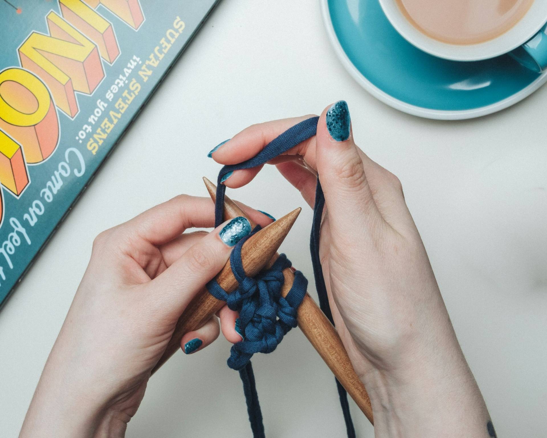 A growing number of young people are turning to tactile, analog hobbies like needlepoint or knitting as a form of therapeutic stress management, a way to escape technology, and to do something with their hands instead of doomscrolling, reconnecting with creativity and exploration.